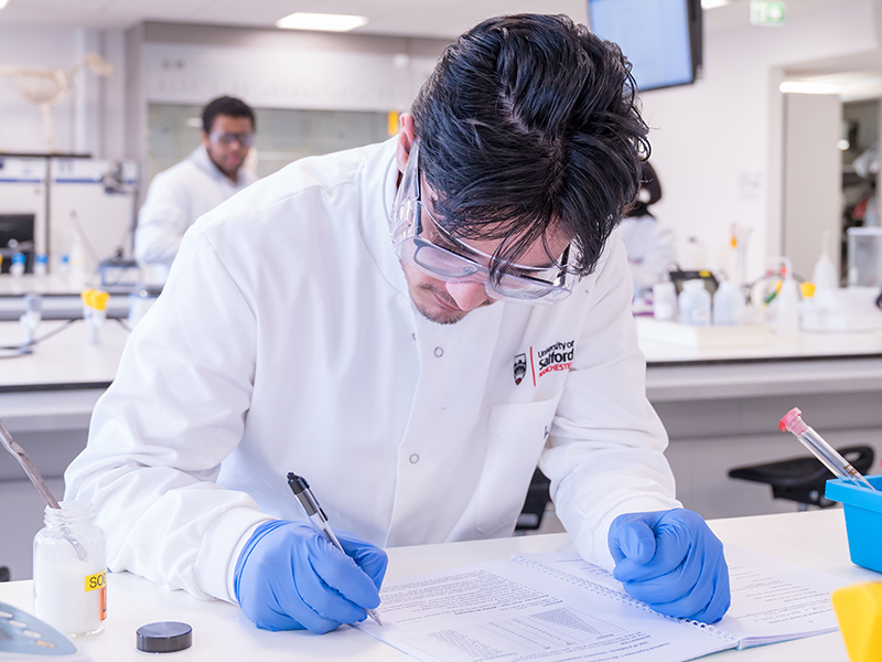 University of Salford Biomedical Science student making notes