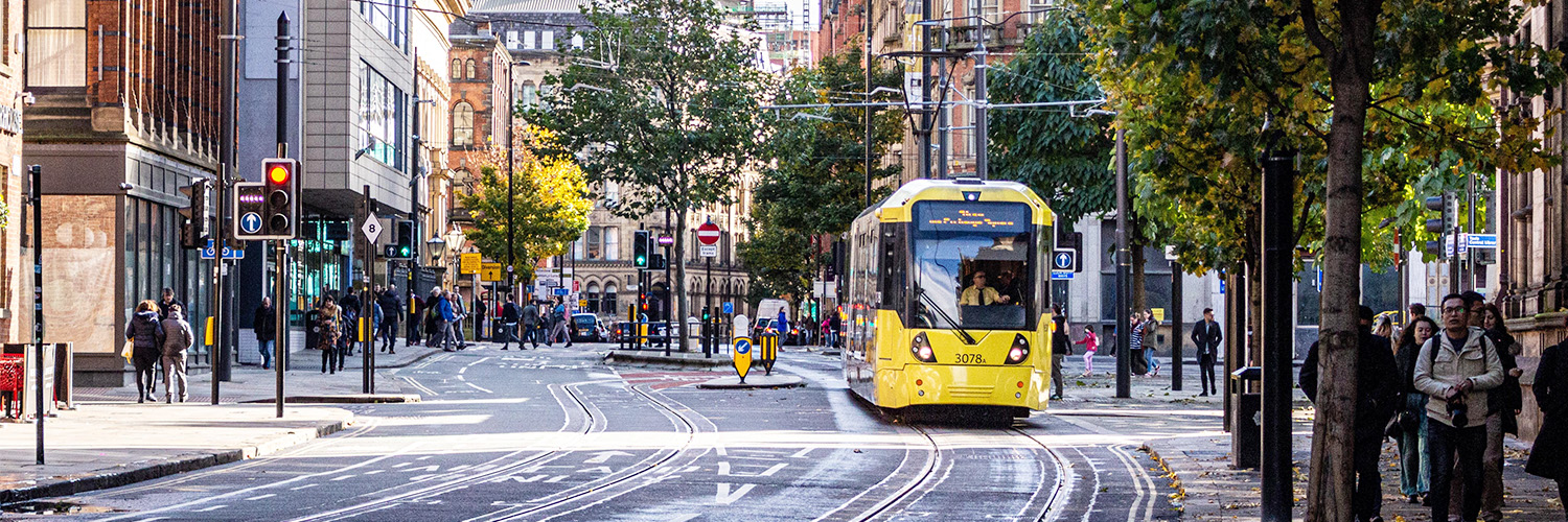 Tram travelling through Manchester city centre