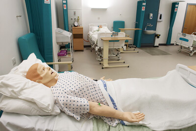 Nursing training doll in hospital bed in the Simulation Suite, University of Salford