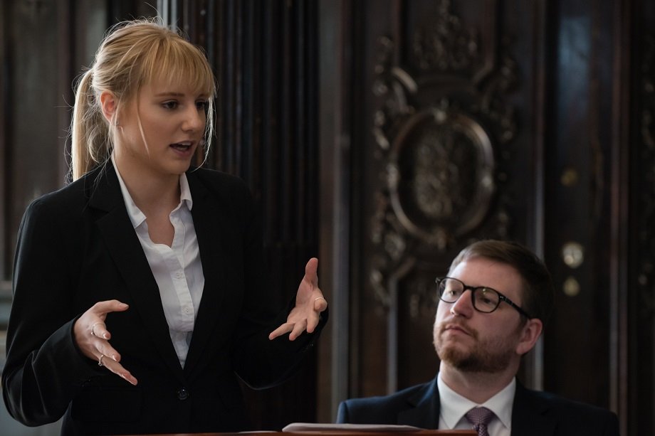 Two law students in a courtroom