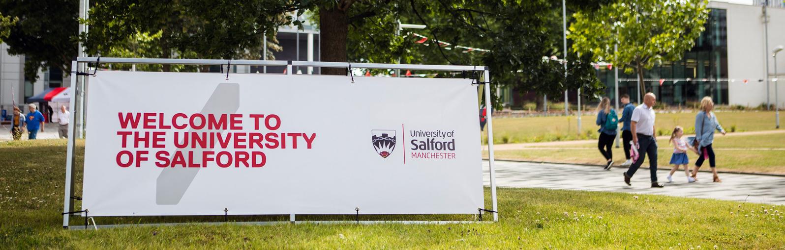 Welcome to the University of Salford signage on campus